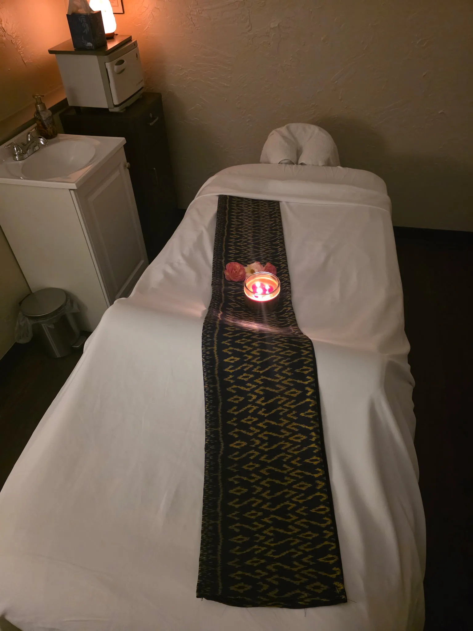 Massage room with warm lighting